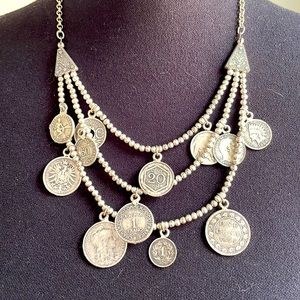 Unique boutique necklace made of faux foreign coins